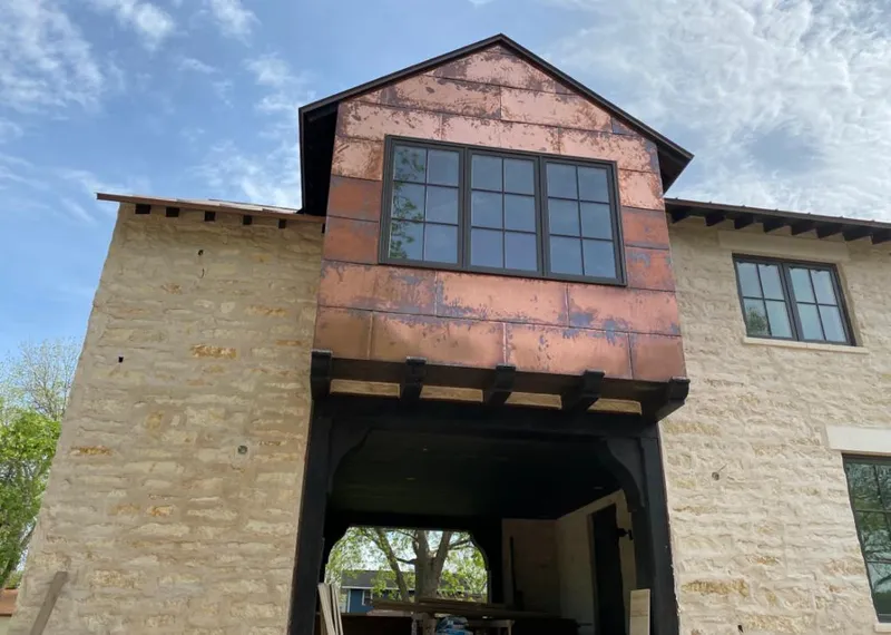 Copper metal panel facade on a stone building for Roof Repair in Fortuna Foothills